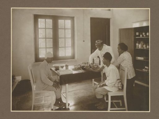 Nurses and patients in the clinic of the Ngandjoek sugar factory on Java