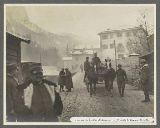 Presumably Italian soldiers, a horse, a wagon and Doctor Cervelli (right) in a street in Cortina d'Ampezzo in the Dolomites