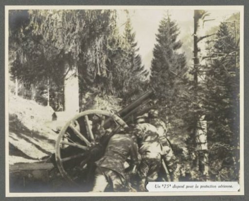 Soldiers positioning a 75 mm anti-aircraft gun on a mountainside in the Dolomites, presumably Italians