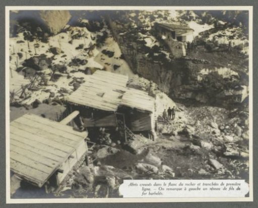 Shelters dug into the rocks and barbed wire obstacles at the front in the Dolomites