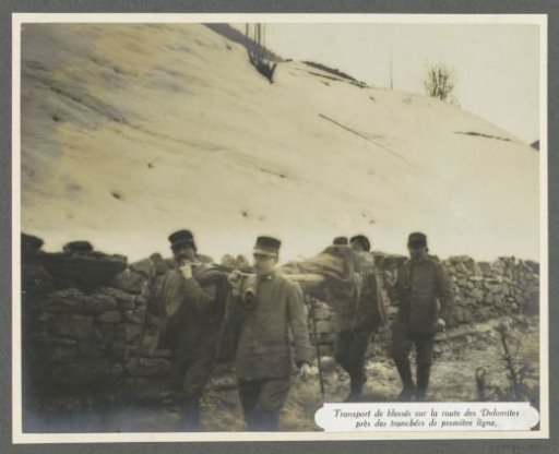 Wounded transport by stretcher over a road in the Dolomites, presumably Italians