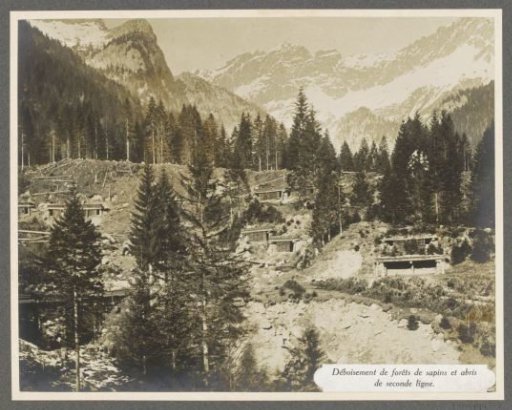 Deforested mountain slopes with shelters behind the front in the Dolomites