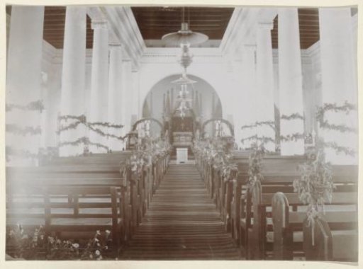Interior of a church decorated with plants