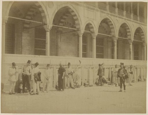 Men at a fountain in the courtyard of (possibly) the Süleymaniye Mosque in Istanbul