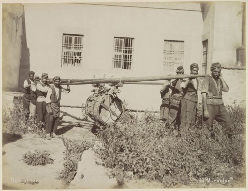 Turkish porters with a large barrel