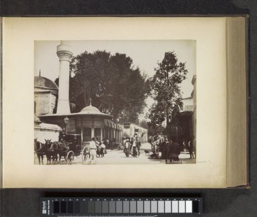 Street view in Istanbul with passers-by and carriages