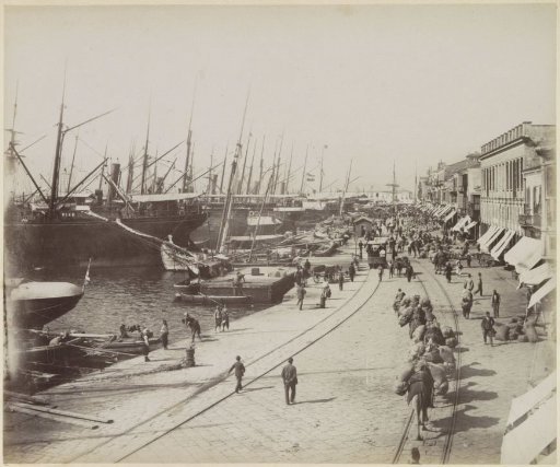 Harbor quay with laden donkeys and ships in Smyrna