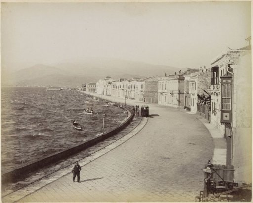 View of the rough sea and a quay in Smyrna
