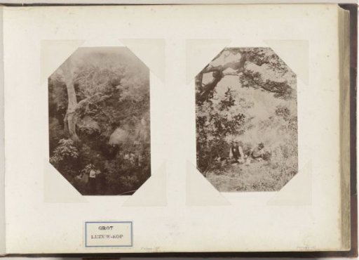 Two men having a picnic under a tree, presumably in South Africa
