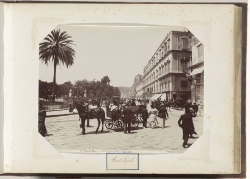 Street in Naples with horse-drawn carriages and passers-by
