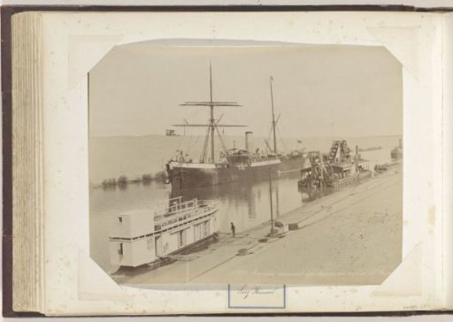 Ship, houseboat and dredger in the Suez Canal