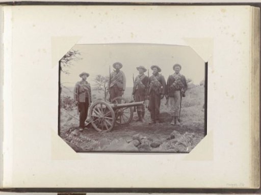 Armed men with a captured cannon in South Africa