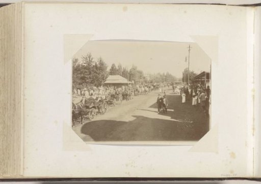 Market street in South Africa with open carriages and pedestrians