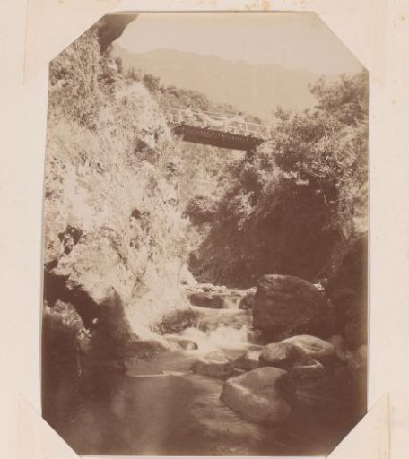 Porters on a footbridge over a mountain stream on Madeira