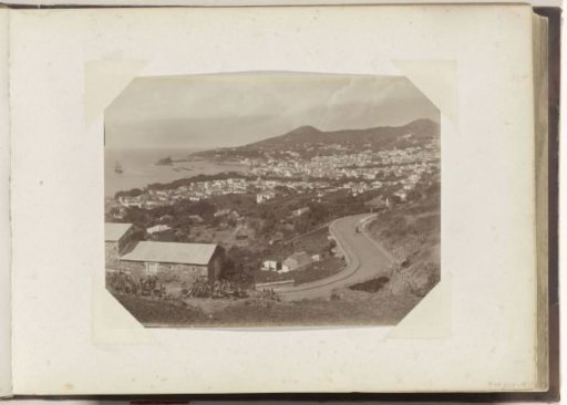 View of Carvalhal Street and a bay with ships in Funchal (Madeira)