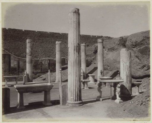 Columns and Sculptures near a Wall in Pompeii