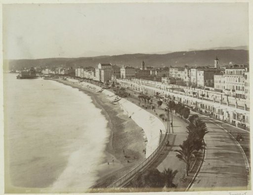 View of the Promenade des Anglais in Nice with a pier in the background left