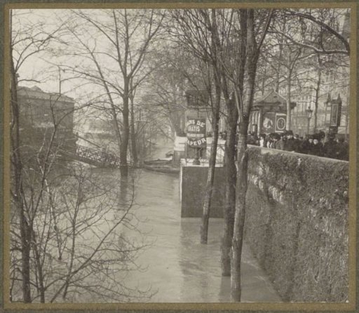 People viewing the high water level of the Seine in Paris from the quay