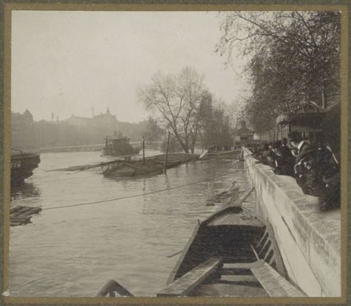 People viewing the high water level of the Seine in Paris from the quay