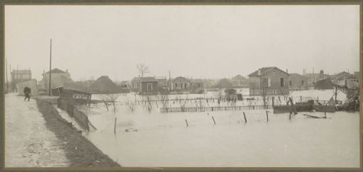 Panoramic photograph of flooded gardens and sunken houses in a suburb of Paris