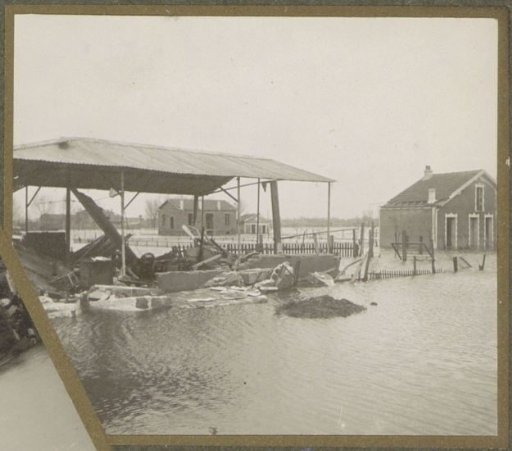 Destroyed barn and house in a flooded suburb of Paris