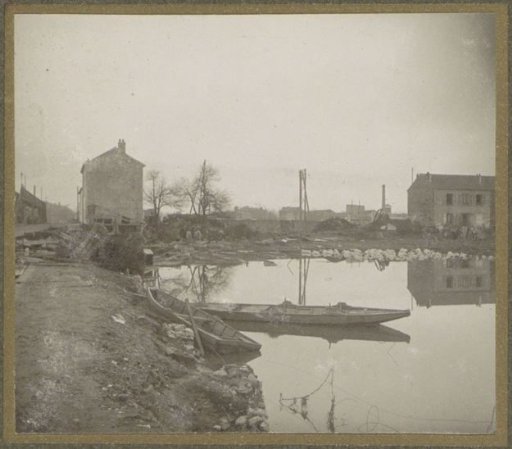 Boat and houses in a flooded suburb of Paris
