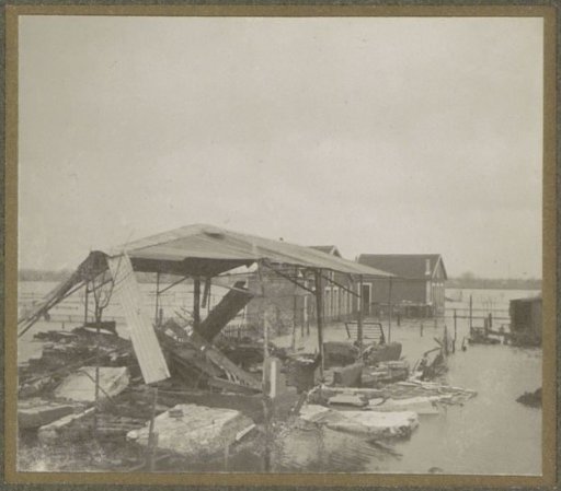 Destroyed barn on flooded land in a suburb of Paris
