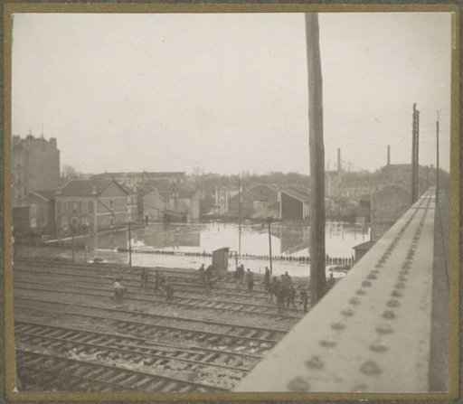Work on railway tracks during the Paris flood, viewed from a bridge