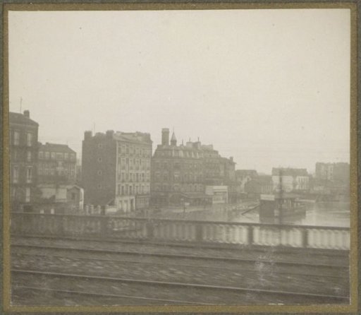 Flooded street and buildings during the Paris flood, viewed from a train