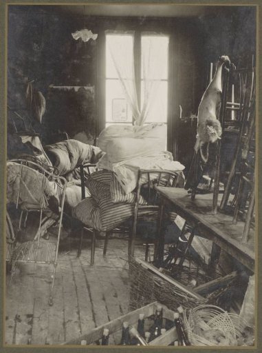 Interior of a room with rescued furniture and bedding during the flooding of Paris
