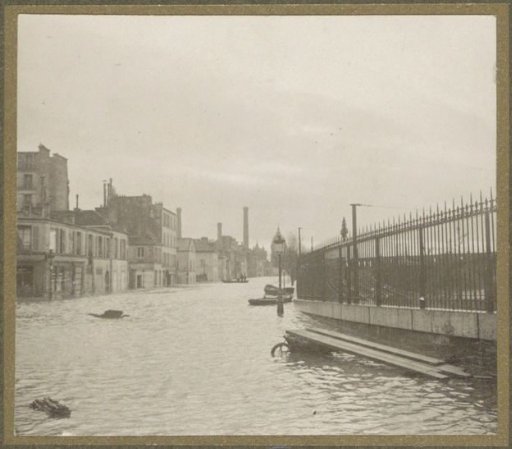 Flooded street with a fence during the flooding of Paris