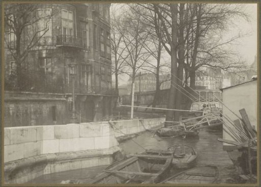 Boats along a quay during the flooding of Paris