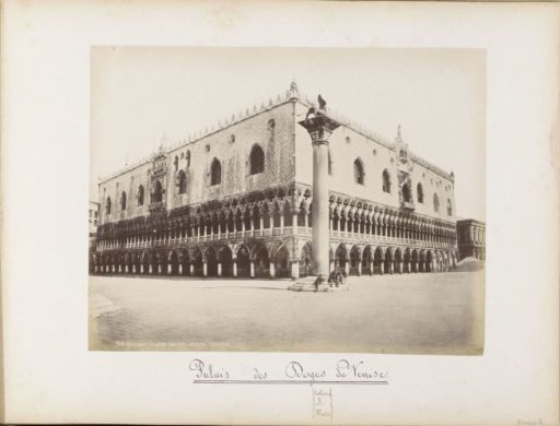 View of the Doge's Palace and a pillar with lion statue in Venice