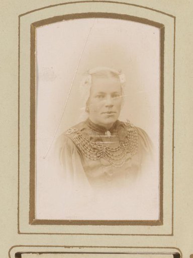 Portrait of a woman in a white linen cap