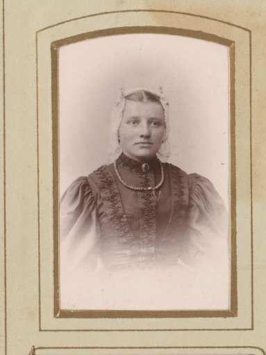 Portrait of a woman in a white linen cap and necklace