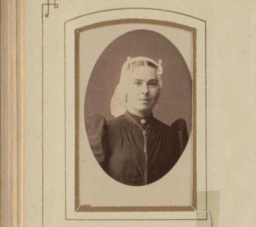 Portrait of a young woman in a white linen cap and necklace