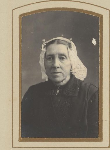 Portrait of a woman with a white traditional cap