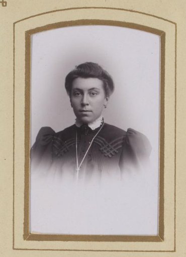 Portrait of a woman with earrings and necklace
