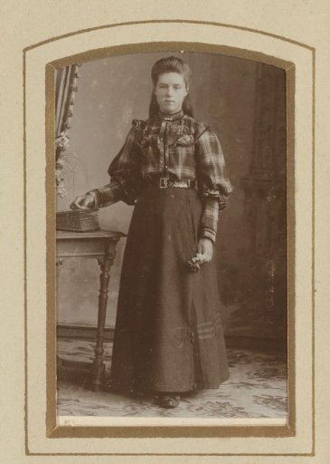 Portrait of a standing young woman