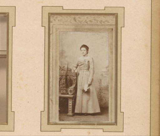 Portrait of a Standing Girl with Flowers in Her Hand, Standing Beside a Decorated Bench