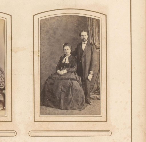 Portrait of a man and a seated woman