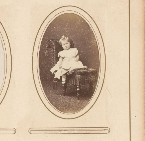 Portrait of a child sitting on a chair