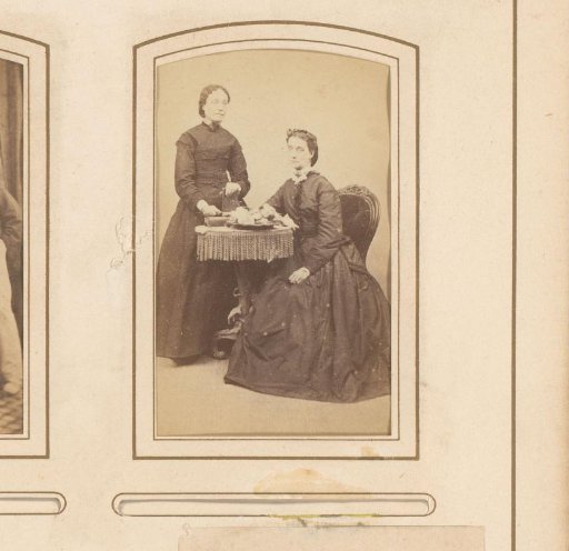 Portrait of two women around a table