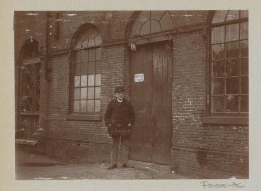 Man standing before an office door