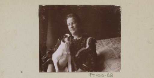 Woman with a dog on her lap in a chair