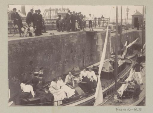 Onlookers watching the lockage of the Hollandia boat in the Oranjesluizen in Amsterdam