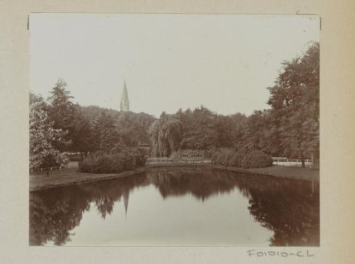 Pond in the Amsterdam Vondelpark, in the background a church