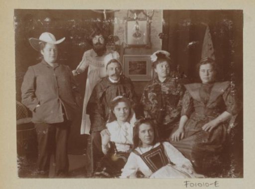 Men and women in costume in a room