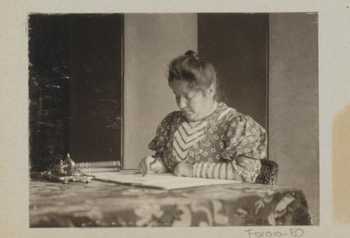 Woman writing at a table