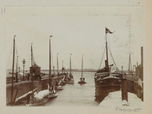 Sailing ships entering the Oranjesluizen in Amsterdam